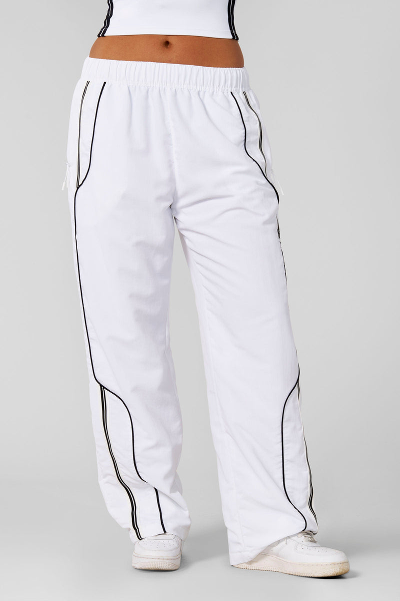 W204 - Drift Track Pant— bold racing-inspired side design with a relaxed, oversized fit for sporty, everyday style and comfort in White
