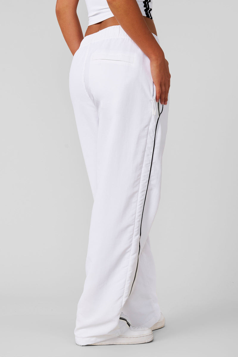 W204 - Drift Track Pant— bold racing-inspired side design with a relaxed, oversized fit for sporty, everyday style and comfort in White