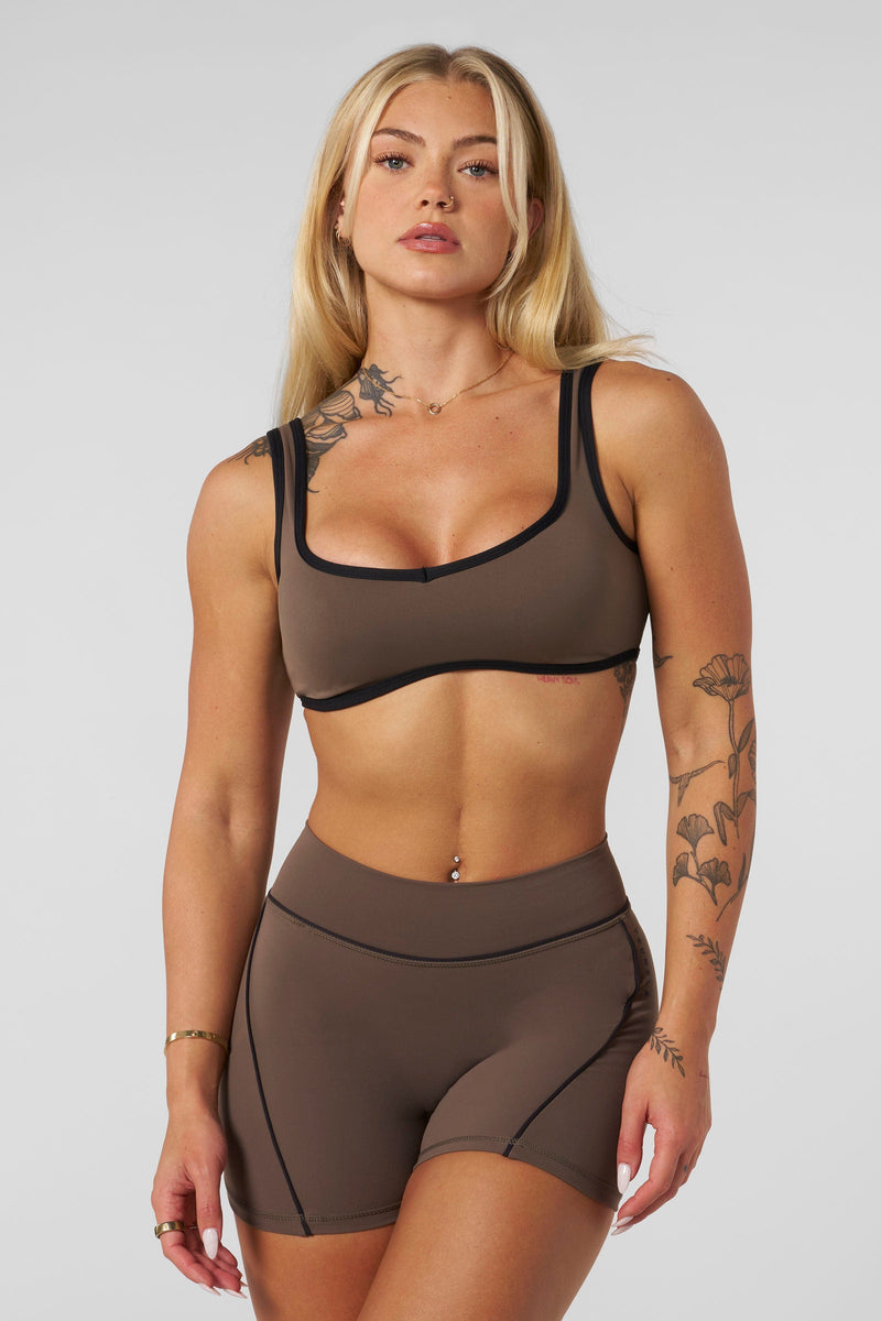 W366 - Elevate outline Bra
— soft, brushed fabric with a sweetheart neckline, removable pads, and a comfortable fit for lounging, light activity, or layering in Taupe