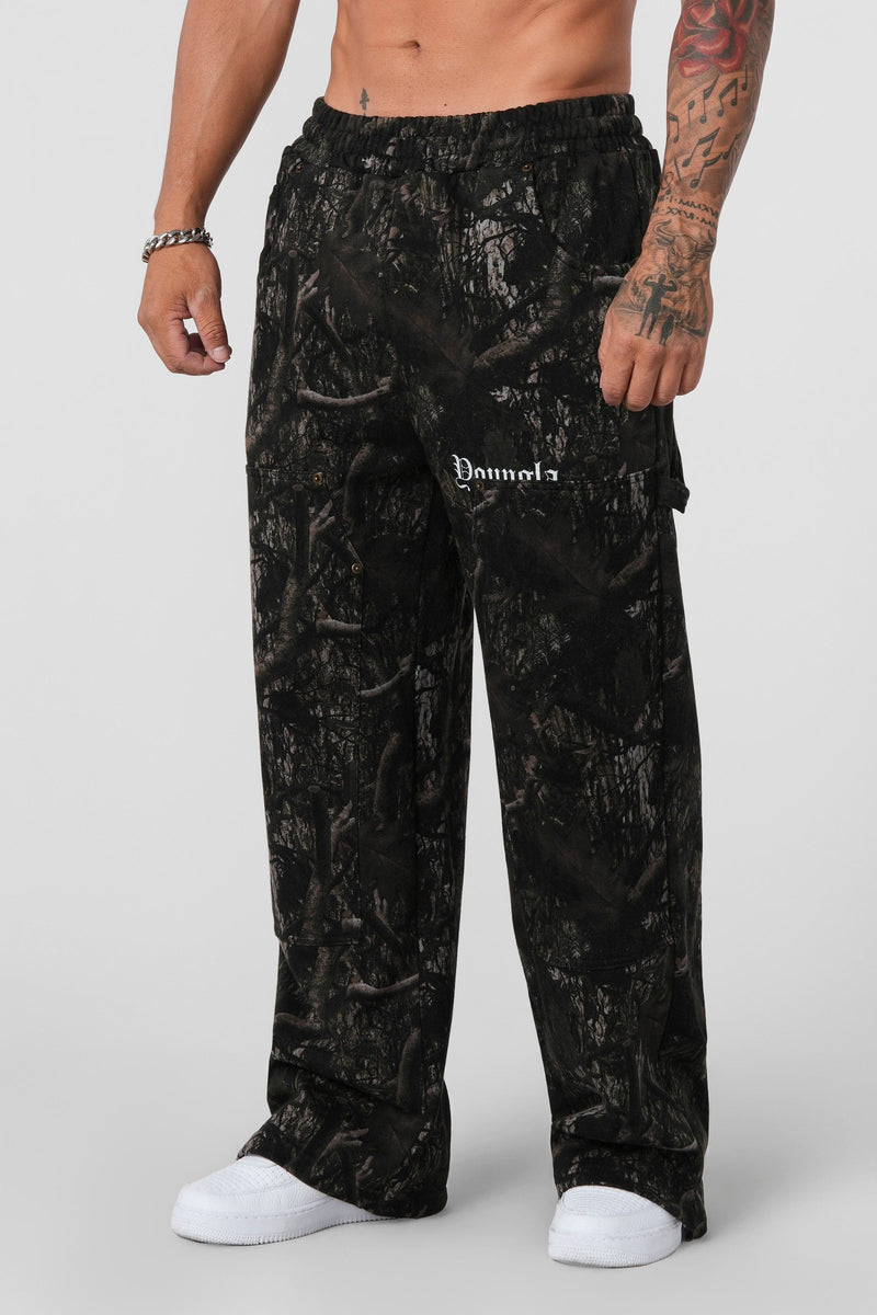 2055 - Carpenter Sweats for Men: 100% cotton heavyweight 460 GSM baggy sweats with workwear-inspired stitch lines, premium feel, and comfortable utility design in color Dark Tree camo.