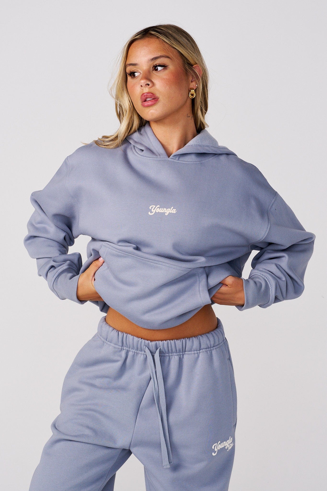 W566 Soft Serve Hoodie for women with super soft, fluffy fleece and featuring a fun puff print in Dusty Blue.