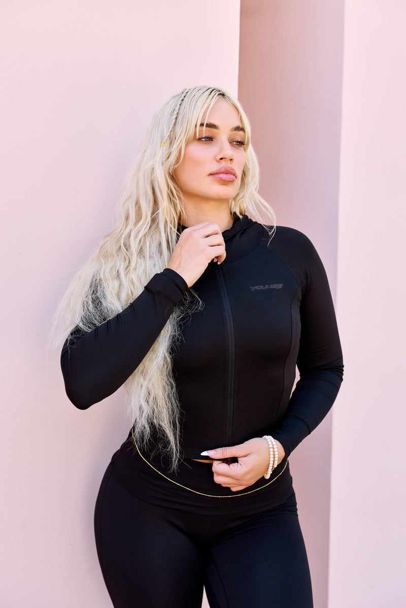 W564 Flashback fitted jacket for women complete with a full zip closure and attached hood in color Black.