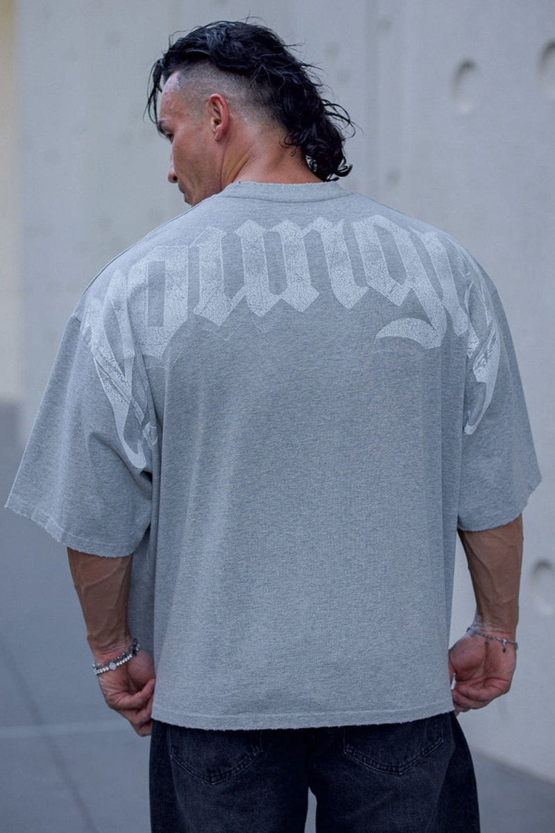 4159 - Huge Tees for Men: Bold gothic logo tee with boxy draped fit, vintage faded 100% cotton, and heavyweight presence in color Heather Grey.