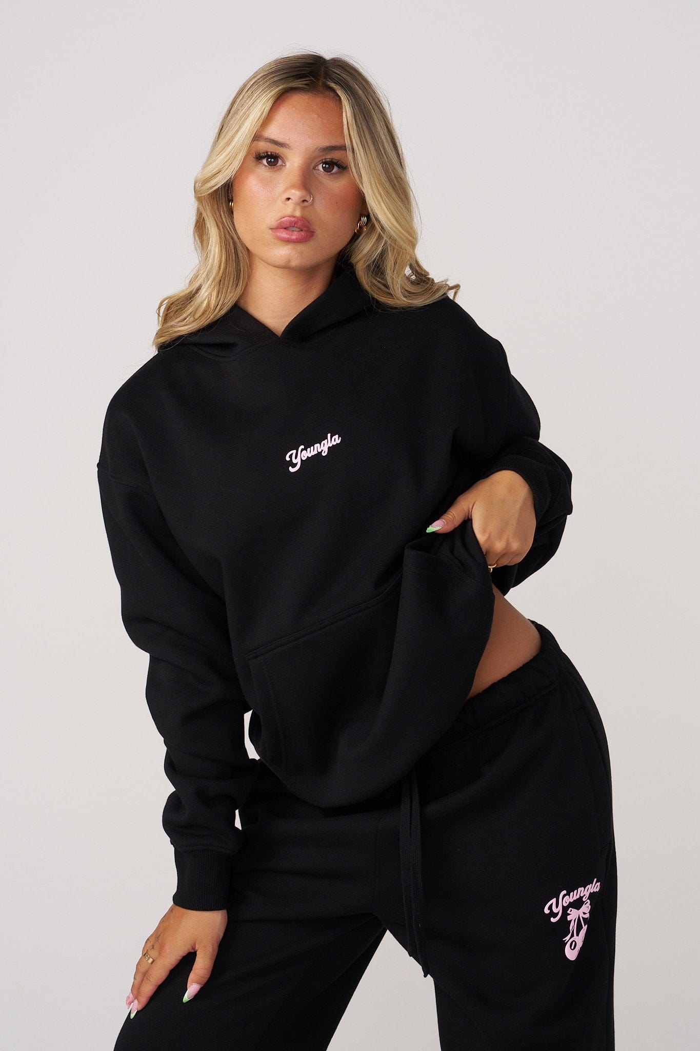 W566 Soft Serve Hoodie for women with super soft, fluffy fleece and featuring a fun puff print in color Black.