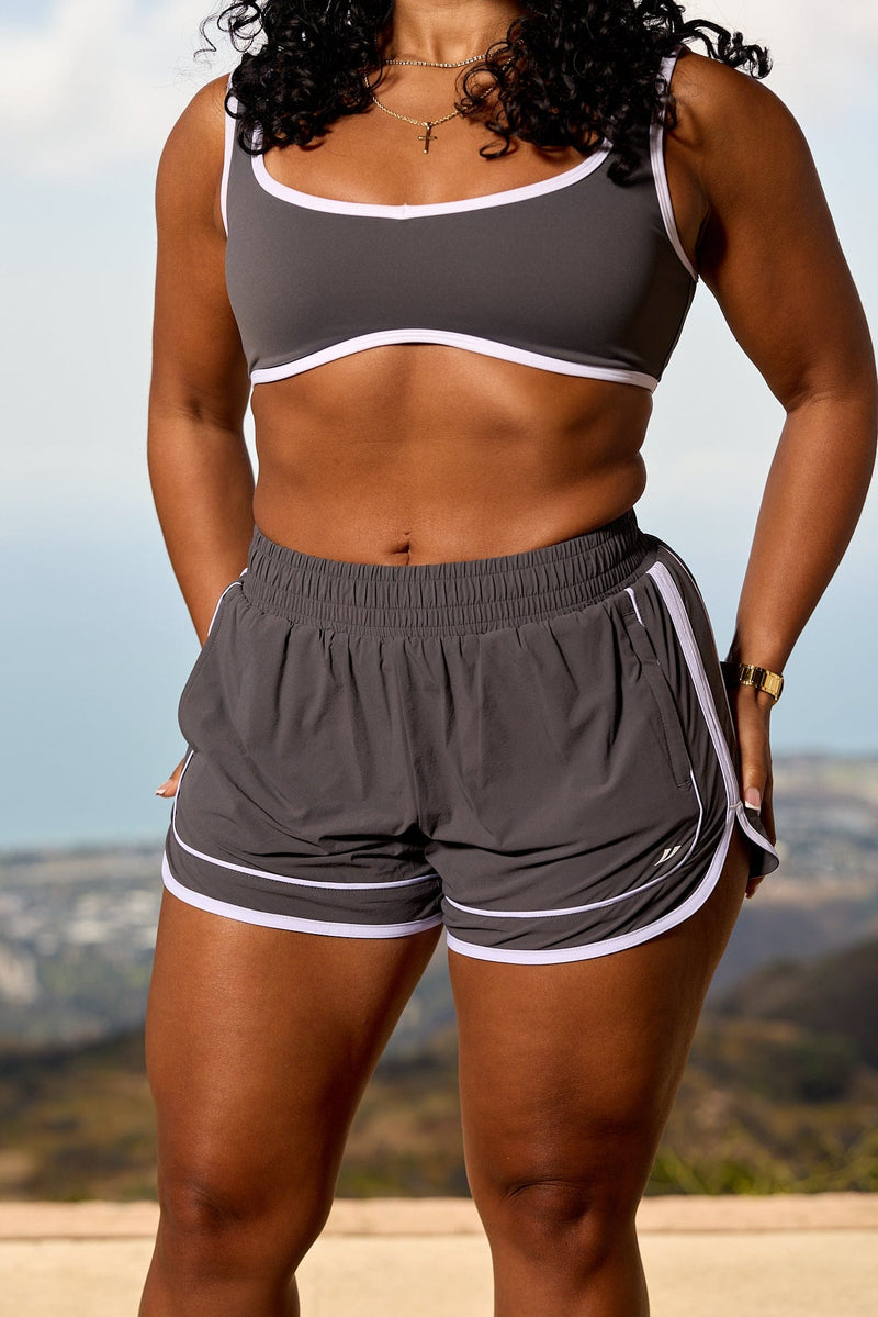 W175 - Elevate Running Shorts for woman the adjustable drawstring and pocket waistband with Color Charcoal.